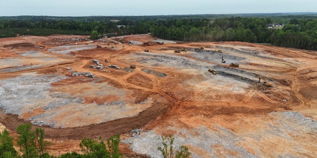 default Excavation site with machinery and construction materials.