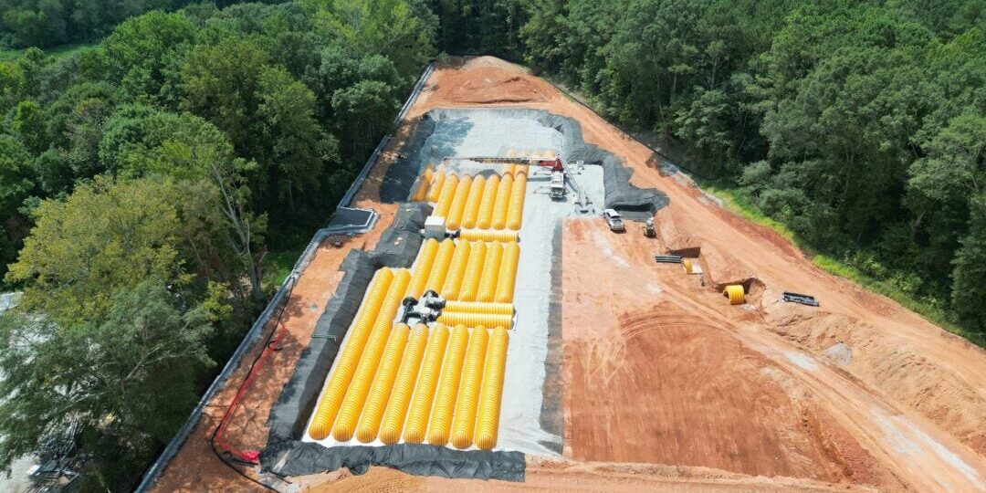 default Aerial view of construction site with yellow pipes.