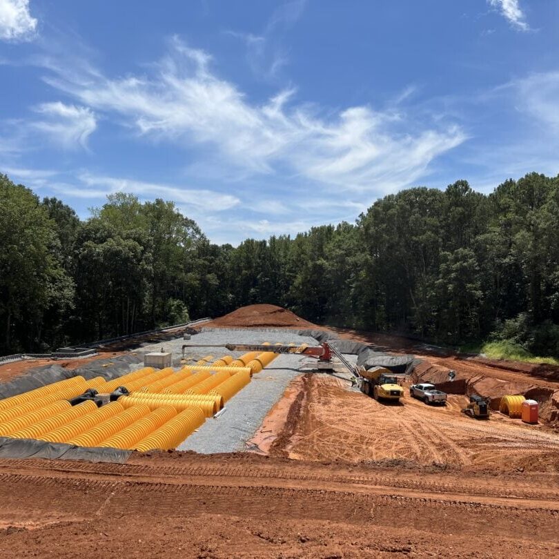 Installation of Underground Stormwater Detention System Underground stormwater detention system installation with large yellow chambers