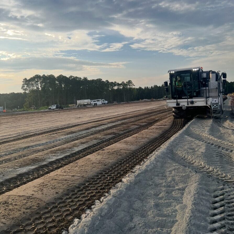 Early Morning Soil Stabilization with Equipment Tracks Early morning construction site with soil stabilization tracks and machinery