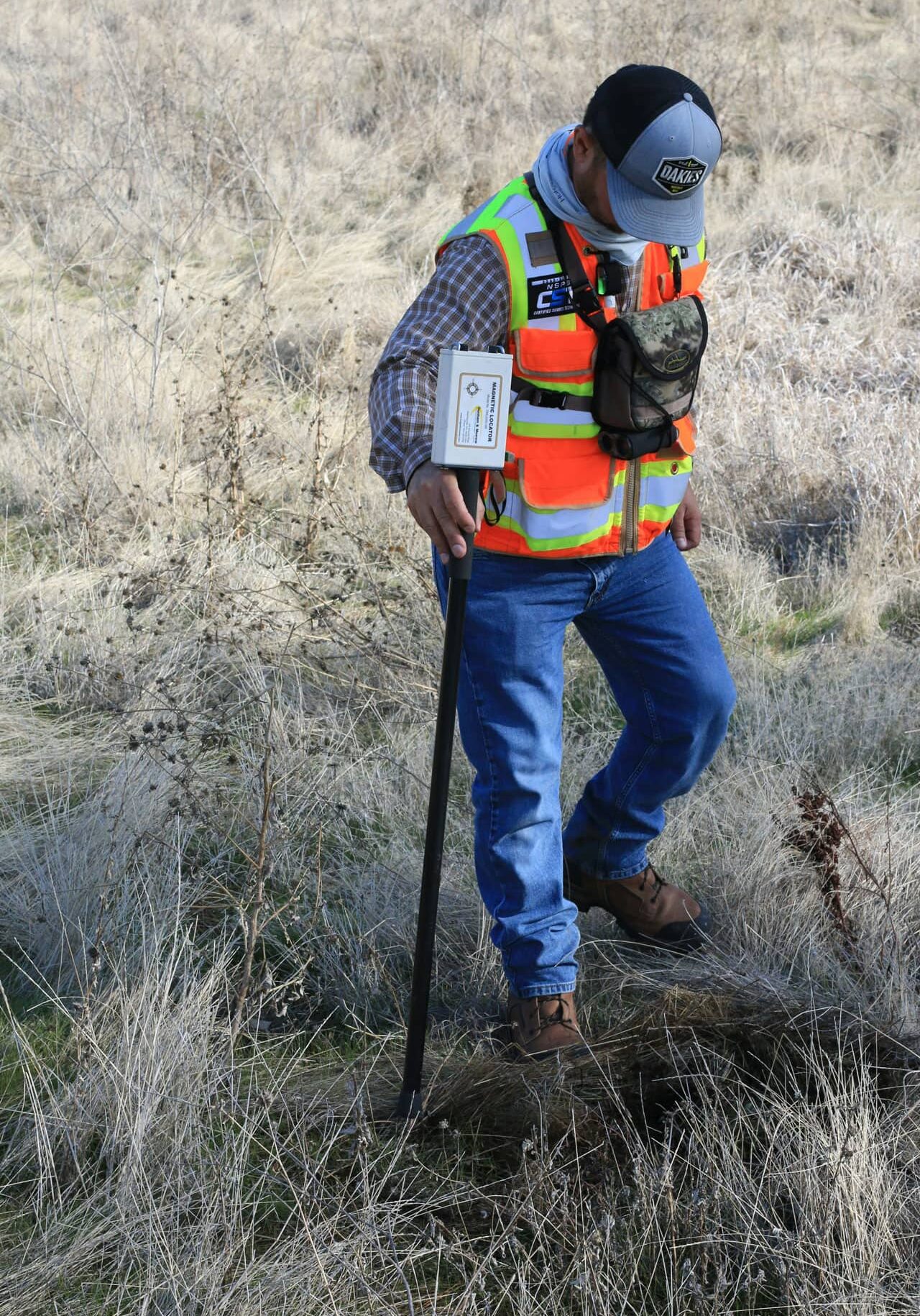 Surveyor Marking Ground with Soil Probe Surveyor marking ground with soil probe during field inspection